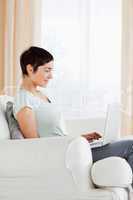 Portrait of a short-haired woman working with a laptop