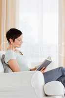 Portrait of a short-haired woman reading a book