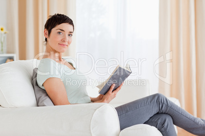 Short-haired brunette holding a book