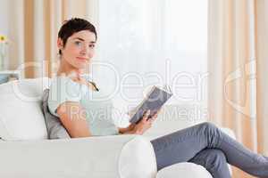 Short-haired brunette holding a book