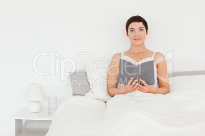 Brunette holding a book