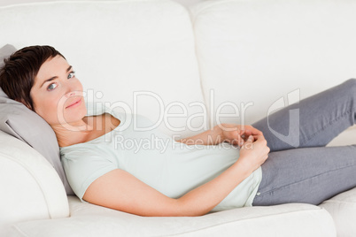 Cute woman lying on a couch