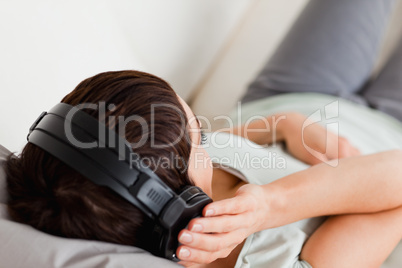 Top view of a woman listening to music