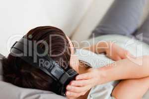 Top view of a woman listening to music