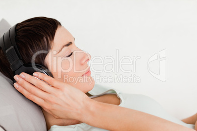 Close up of a short-haired woman enjoying some music