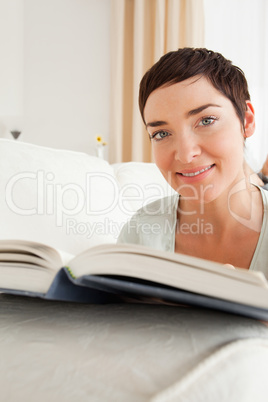 Portrait of a short-haired woman with a book