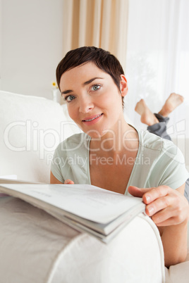 Portrait of a woman with a magazine