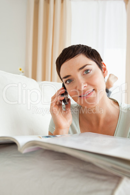 Potrait of a woman with a magazine calling
