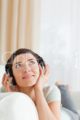 Portrait of a short-haired woman listening to music