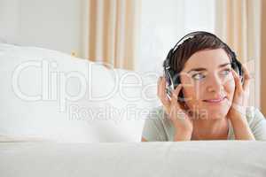 Short-haired woman listening to music