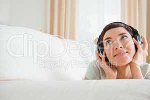 Cute short-haired woman listening to music