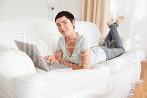 Happy short-haired woman with a laptop
