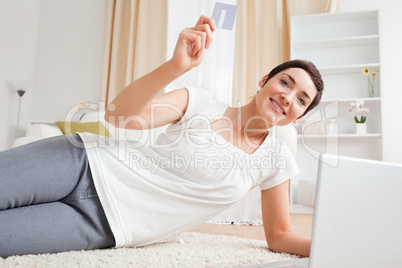 Woman using her credit card to pay online