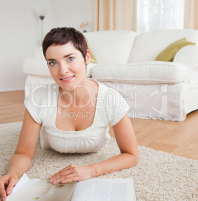 Close up of a brunette with a magazine