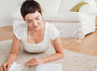 Close up of a brunette reading a magazine