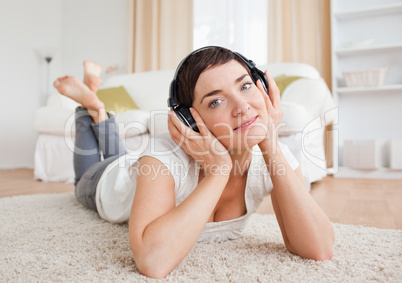 Close up of a delighted woman listening to music