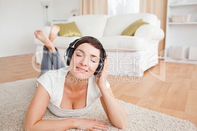 Smiling brunette listening to music
