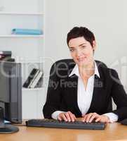 Portrait of a secretary typing on her keybord