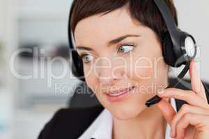 Close up of a professional secretary calling with a headset