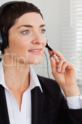 Portrait of a serious secretary with a headset