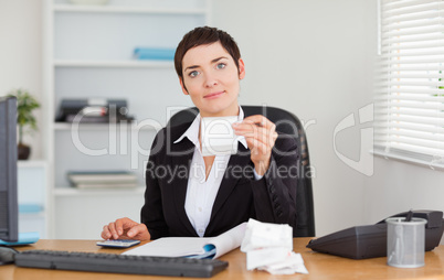 Serious office worker doing accountancy