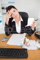 Portrait of a female accountant checking receipts