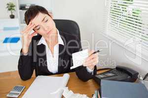 Unhappy accountant checking receipts