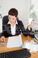 Portrait of an active accountant checking receipts