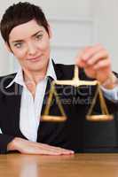 Woman holding the justice scale