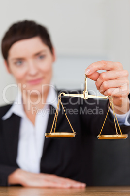 Portrait of a businesswoman holding the justice scale