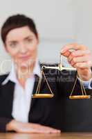 Portrait of a businesswoman holding the justice scale