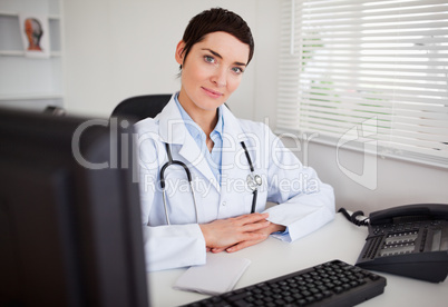 Serious female doctor looking at the camera