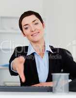 Portrait of a charming business woman giving her hand