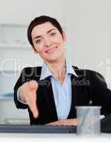 Portrait of a smiling business woman giving her hand
