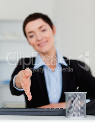 Portrait of a business woman giving her hand