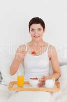 Gorgeous woman having breakfast