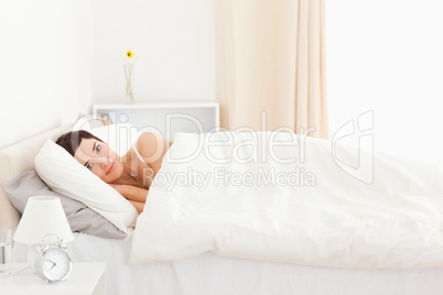 Charming woman waking up