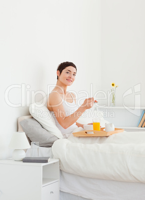 Portrait of a woman eating breakfast