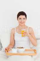 Woman drinking orange juice