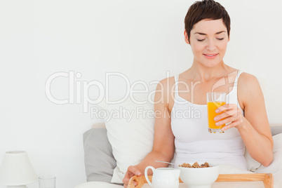 Woman drinking orange juice