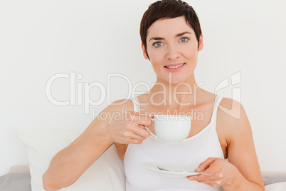 Young woman drinking coffee