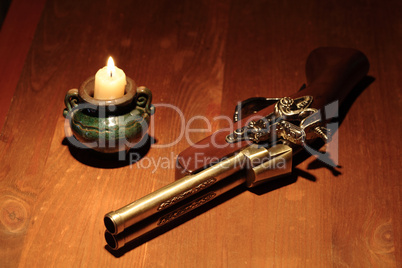 Ancient Pistol And Candle