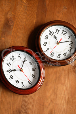 Pair Of Clocks On Wood