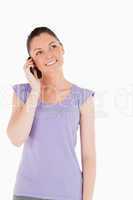 Good looking woman on the phone while standing