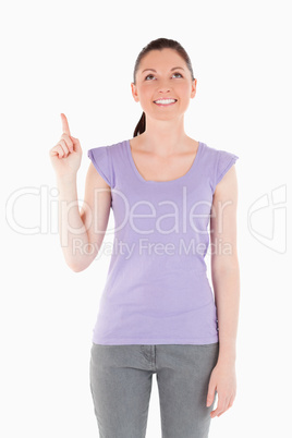 Lovely woman pointing at a copy space