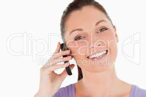 Portrait of an attractive woman on the phone while standing