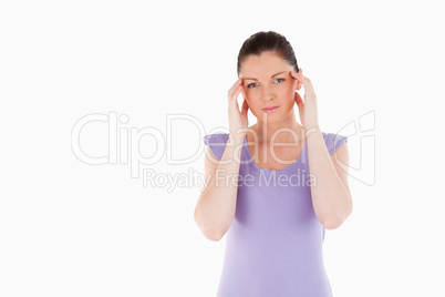 Beautiful woman having a headache while standing