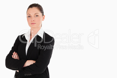 Attractive woman in suit posing while standing