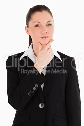 Lovely female in suit posing while standing