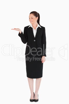 Pretty woman in suit showing a copy space